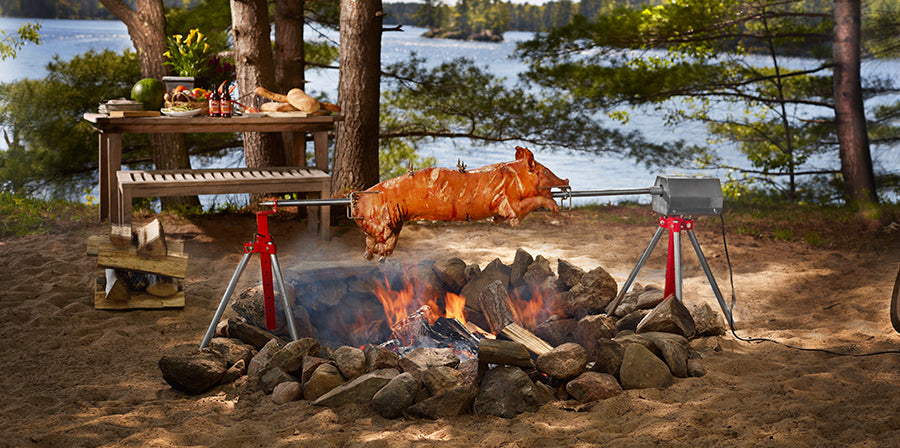 PigOut charcoal pig roaster rotisserie with stainless steel spit and tripod stand